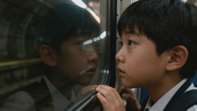 Boy looking out the subway window