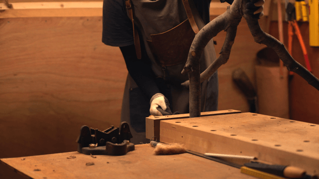 Craftsman working with wood in a workshop