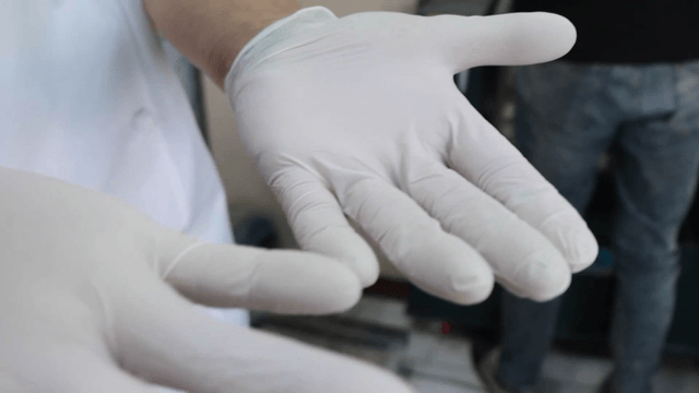 Checking a gloved hand