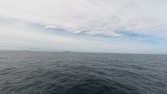 Vast ocean under a cloudy sky