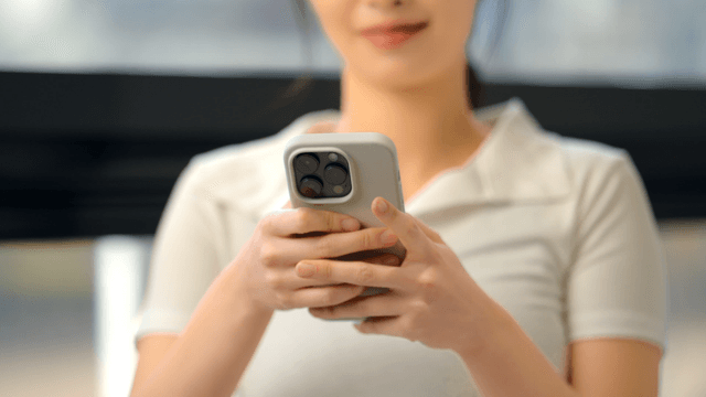 Young woman using a smartphone indoors