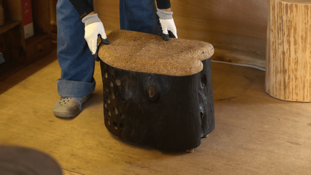 Woodcraft artisan assembling a wooden cork chair