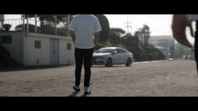 Two students approaching vehicle entering school