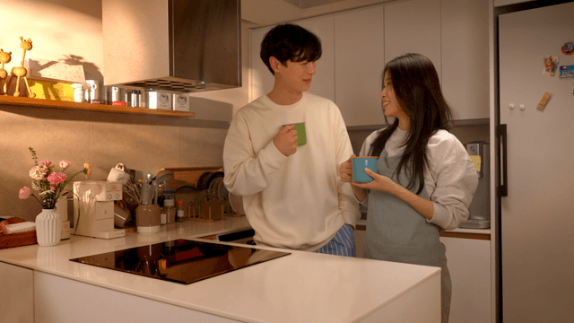 Couple enjoying coffee in cozy kitchen