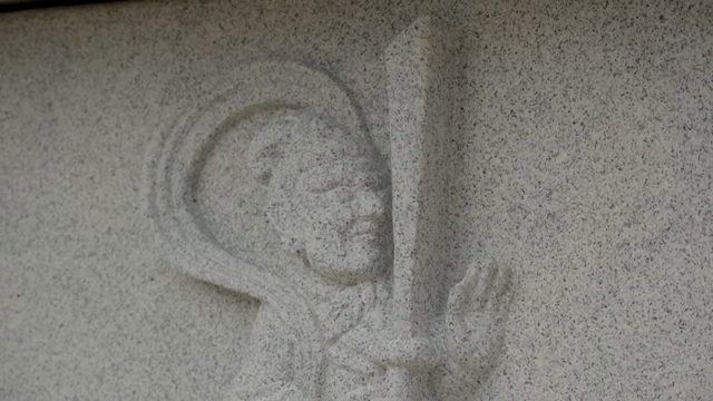 Stone carving of a traditional figure