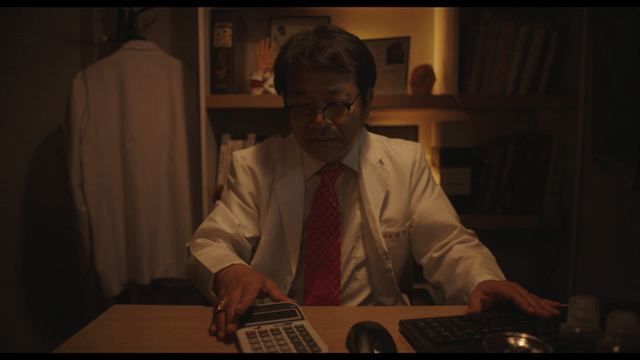 Doctor handing calculator after calculation
