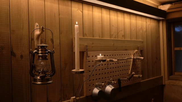 Cozy wooden shelf interior with candlelight