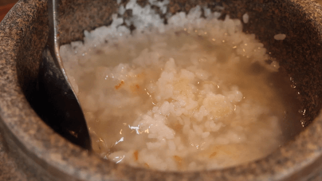 Warm sungnyung served in a hot stone pot