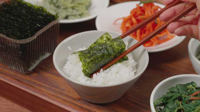 Korean side dishes with rice and seaweed