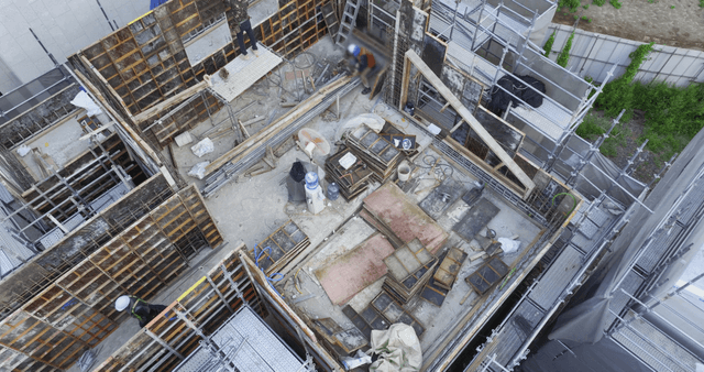 Construction site with workers in helmets
