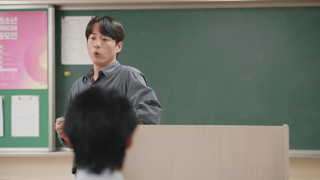 Teacher giving a lecture in a classroom