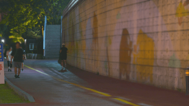 Night running and strolling people