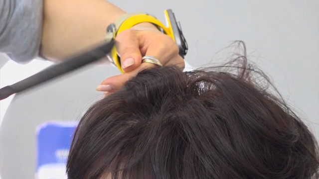 Styling hair with a curling iron