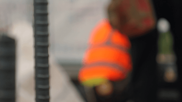 Construction worker in orange vest