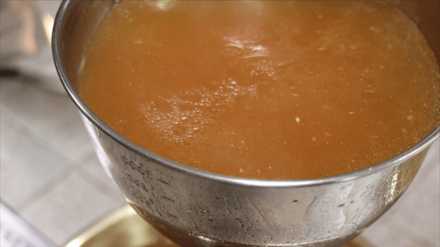 Ladle scooping phellinus linteus chicken broth