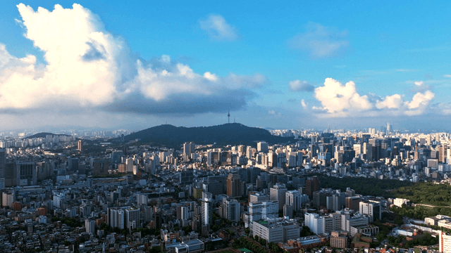 Sprawling cityscape under a blue sky