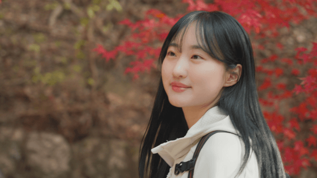 Woman enjoying autumn foliage while hiking