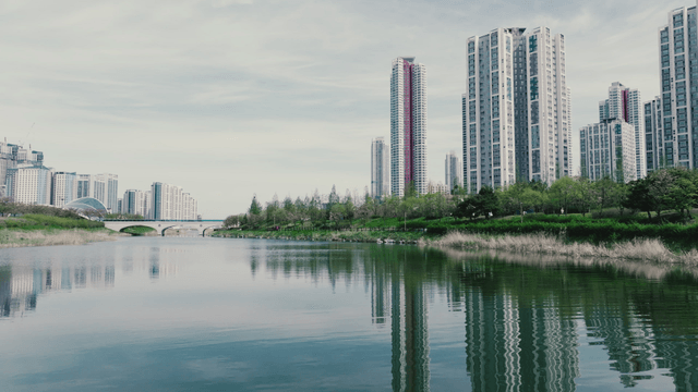 Modern city skyline with a calm river