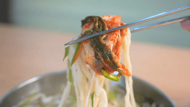 Market hand-cut noodles topped with kimchi