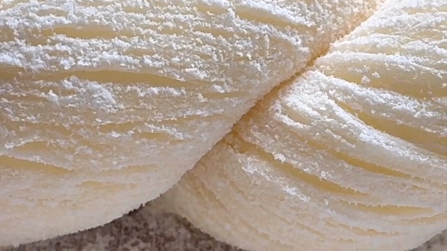 Twisted dough on a floured surface