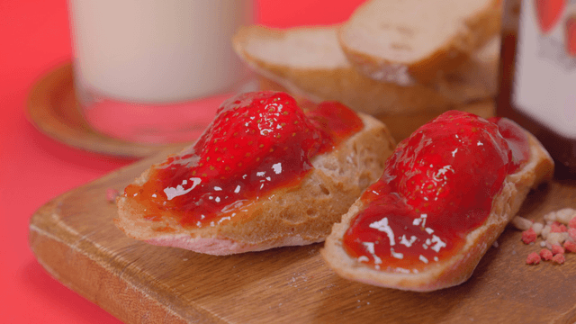 Strawberry jam on bread with milk