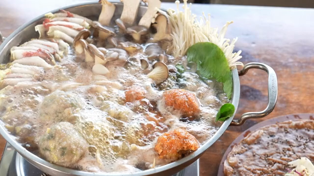 A pot of Korean hot pot with mushrooms