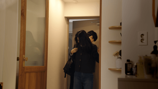 Warm couple entering apartment entrance