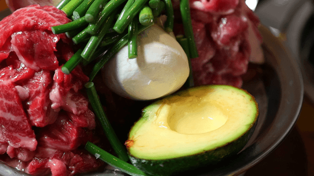 Plate of fresh meat and avocado