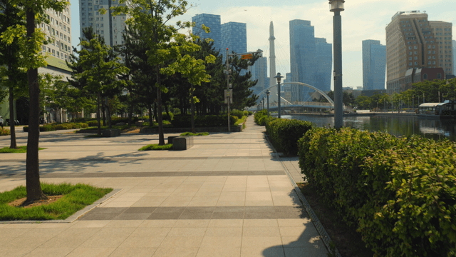 Modern cityscape with trees and river