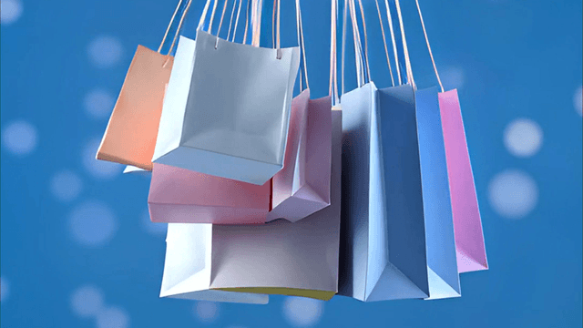 Colorful shopping bags hanging in the air