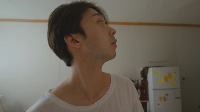 Man looking around his studio room