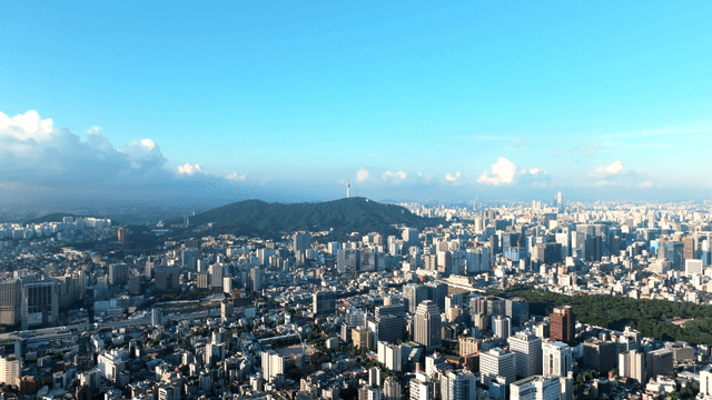 Sprawling cityscape with distant mountains