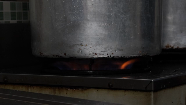 A large pot heating on a stove