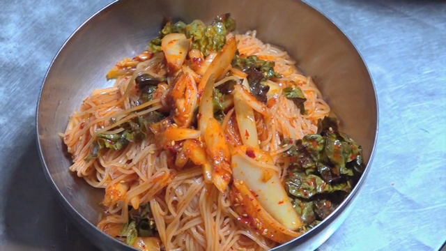 Egg placed on top of spicy noodles