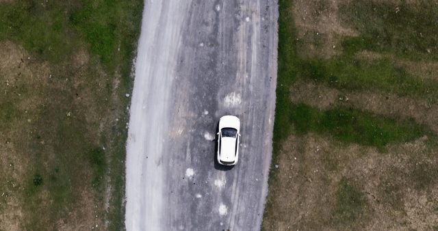 A car driving on a dirt road