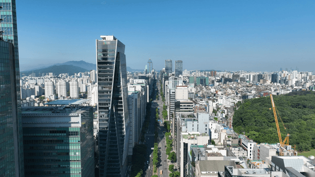 A bustling city with skyscrapers and greenery