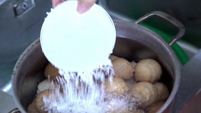 A scene where salt is added to water containing eggs