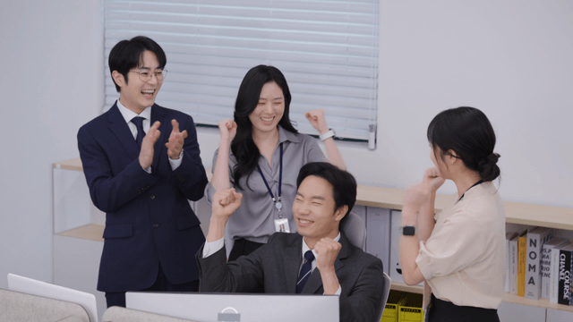 Office team celebrating a success