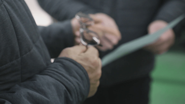 People discussing documents indoors
