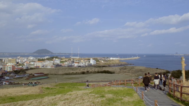 A scenic coastal town with a distant island