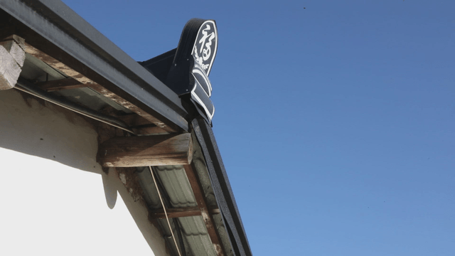 Traditional Korean roof against blue sky