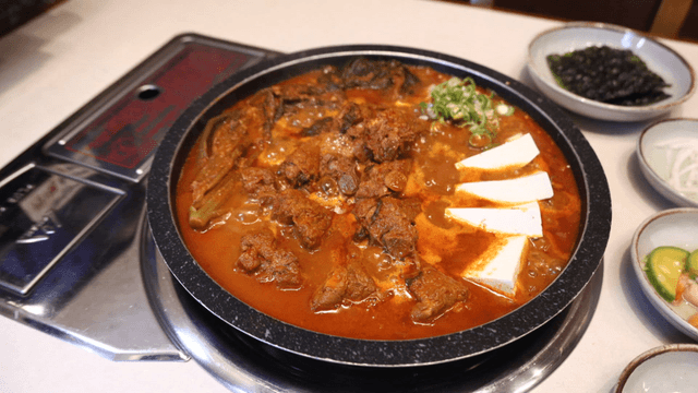 Spicy gatgimchi pork rib stew with tofu and vegetables