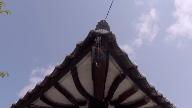 Traditional Korean roof under a clear sky