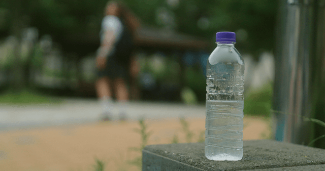 Water bottle on a stone surface outdoors