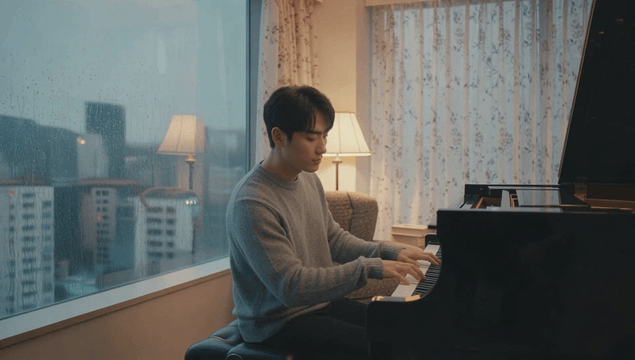 Man practicing piano by window on rainy day