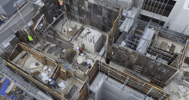 Construction site with workers and scaffolding