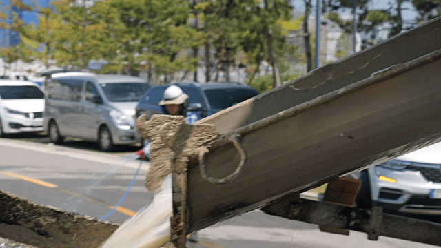 Concrete being poured from a mixer
