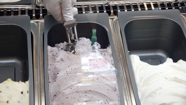 Scooping ice cream with an ice cream scoop