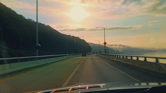 Scenic drive along a riverside road