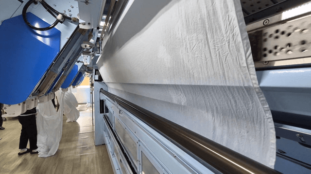 Large fabric washing machine operating in factory